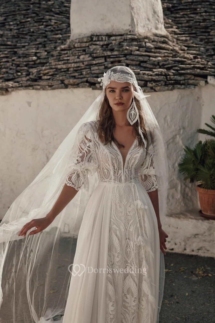 Robe de mariée d'été bohème à manches bouffantes, style empire, en mousseline et dentelle. view 3