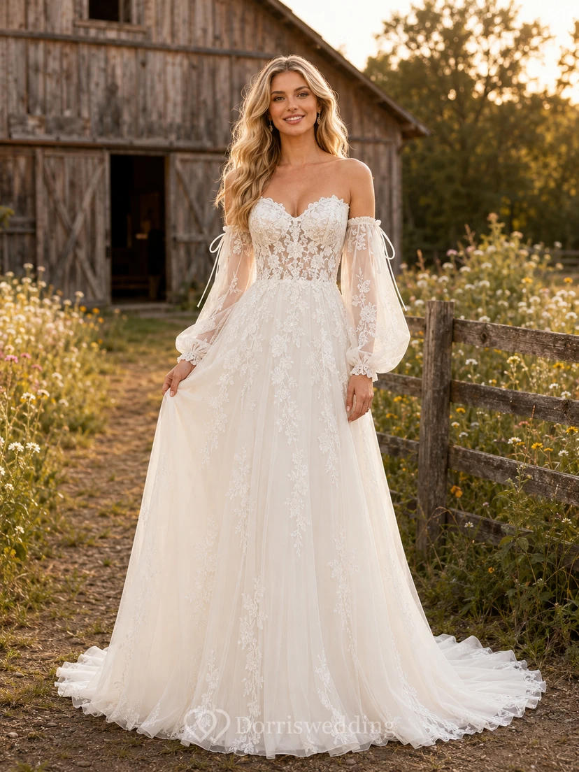 Robe de mariée champêtre en tulle et dentelle, coupe trapèze, épaules dénudées, manches longues, traîne chapelle