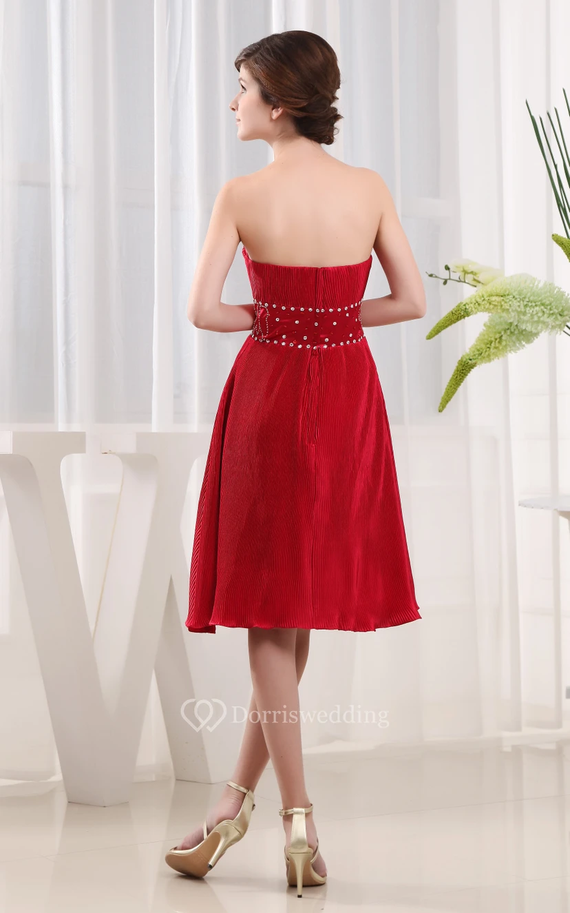 Elegante vestido midi con cuentas, cintura ajustada y bolero. view 2