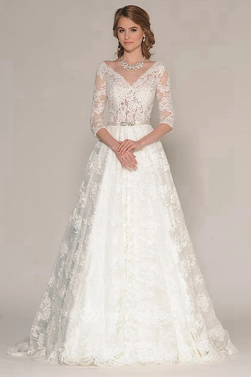 Vestido de novia largo de encaje con escote en V, mangas tres cuartos y apliques, corte en A