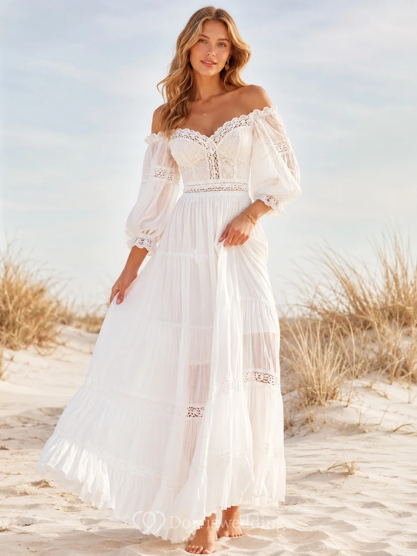 Robe de mariée bohème de plage en mousseline de soie à épaules dénudées, manches bouffantes et volants.