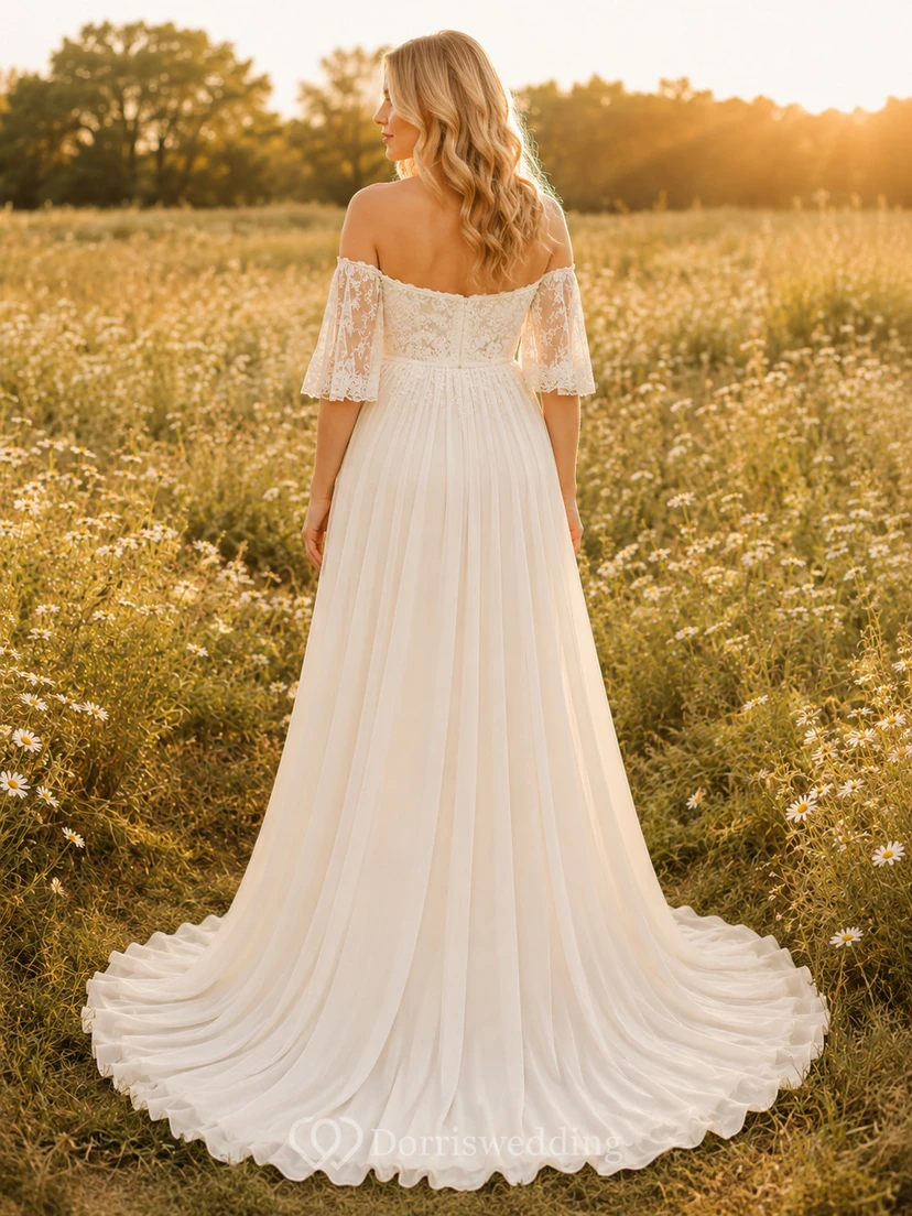 Vestido de novia premamá con escote corazón, mangas de encaje y corte en A con cola. view 2