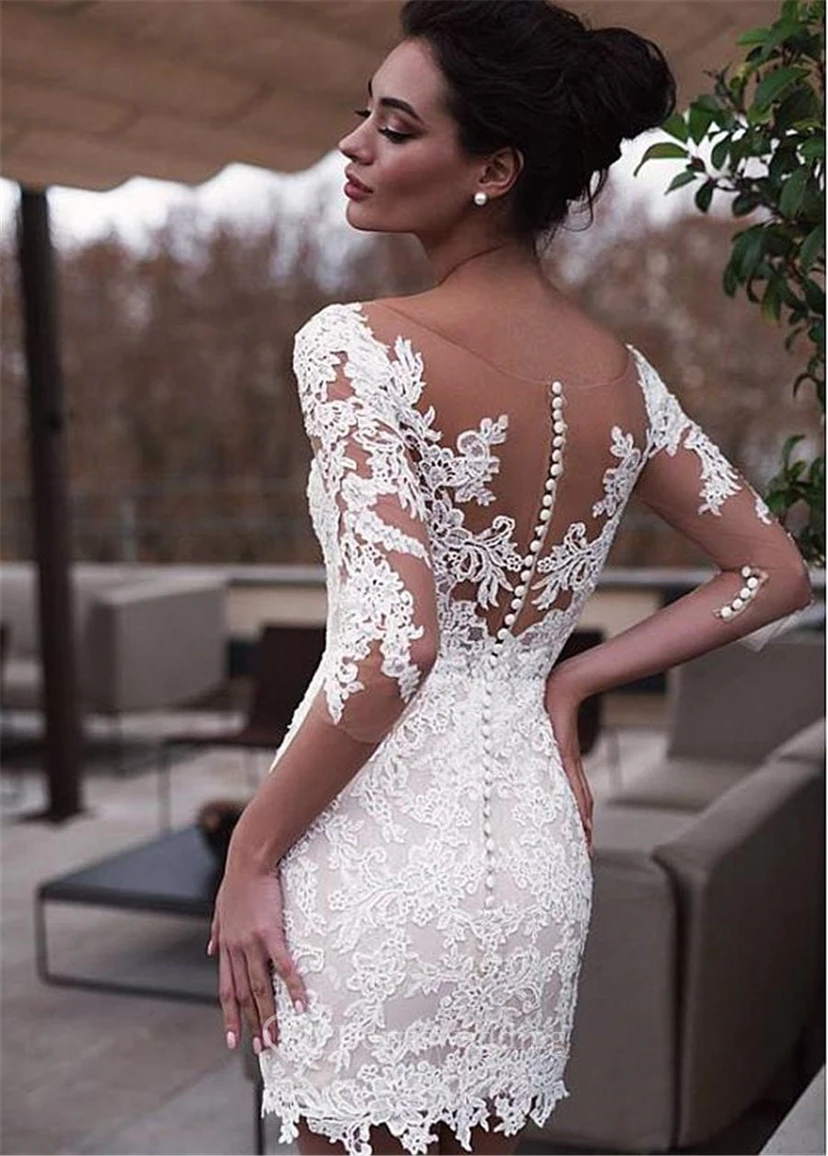 Robe de mariée en tulle vaporeux à manches mi-longues et dentelle, ornée d'appliqués et d'appliqués, avec traîne amovible. view 4