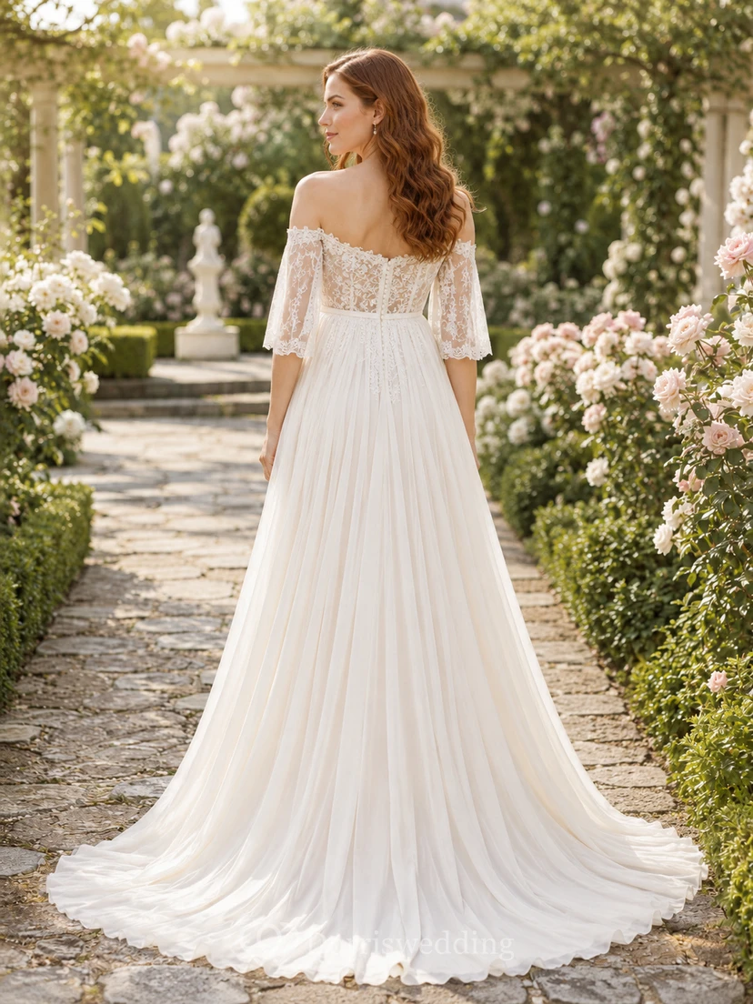 Vestido de novia premamá con hombros descubiertos, encaje y tul, corte en A, mangas con volantes y cola. view 2