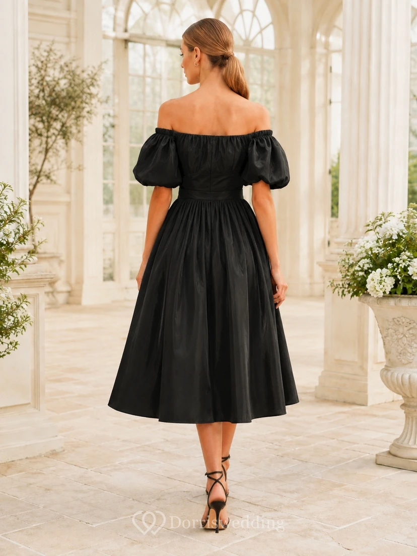 Vestido de satén negro con mangas abullonadas, escote Bardot y corte en A, largo hasta la rodilla. view 2