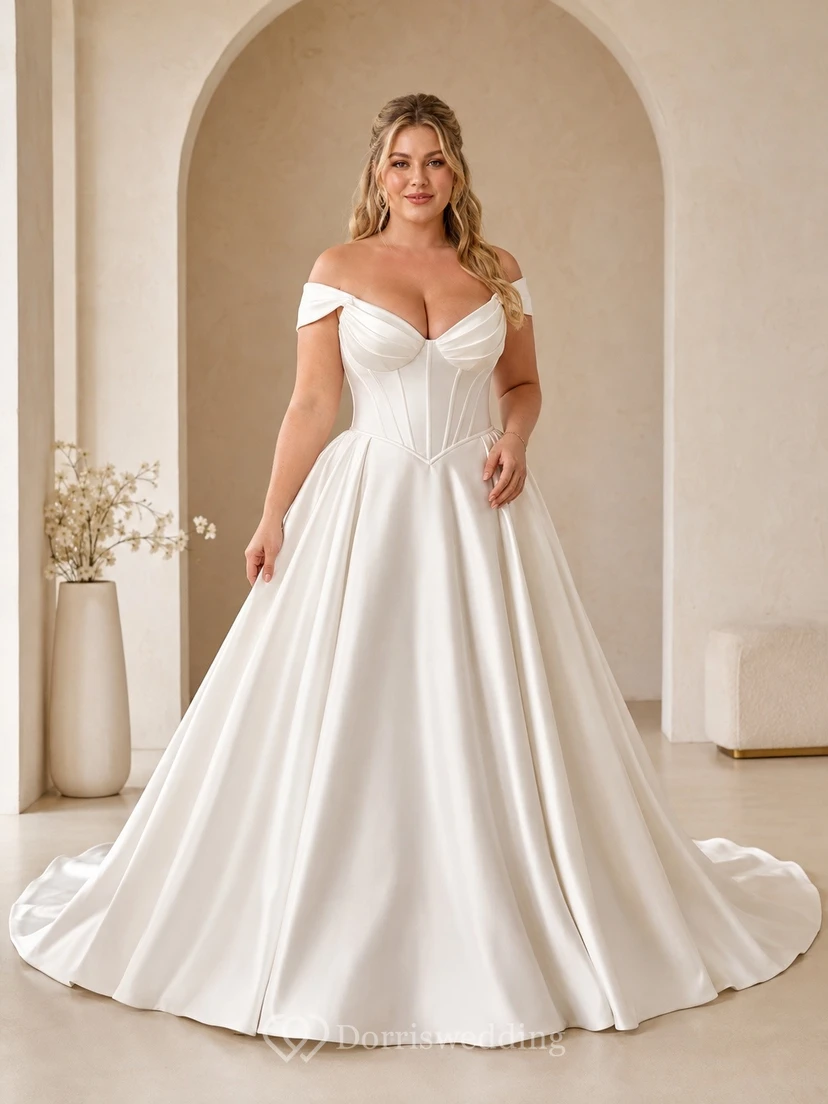 Vestido de novia de satén de manga corta con hombros descubiertos y cola larga.