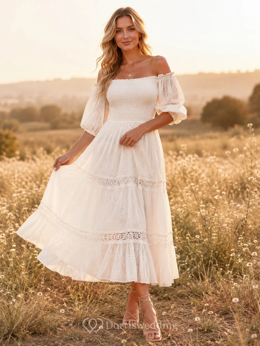 Vestido blanco de encaje con hombros descubiertos, mangas abullonadas fruncidas y volantes, estilo bohemio, ideal para un jardín de té.