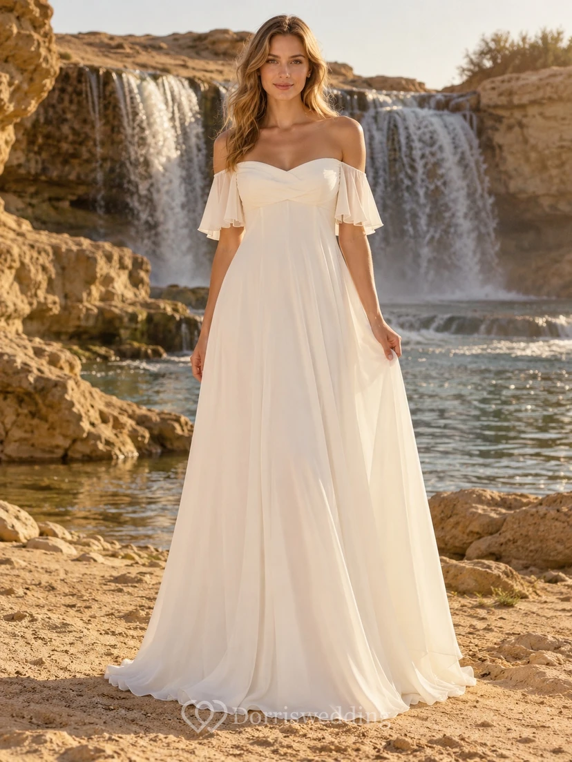 Vestido de novia sencillo de gasa con escote corazón, mangas con volantes y corte en A, largo hasta el suelo.