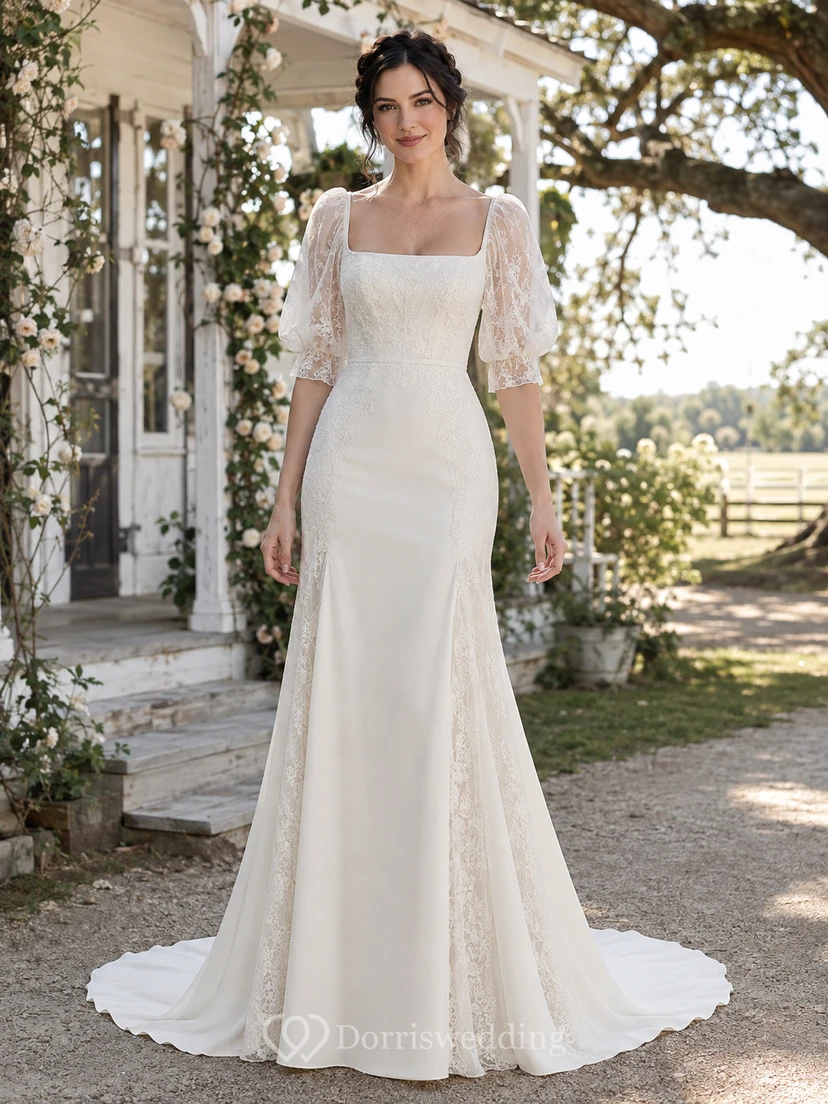 Robe de mariée sirène en satin, dos nu et dentelle, ornée d'un décolleté carré illusion mi-long, manches courtes et ourlet asymétrique, avec traîne chapelle.