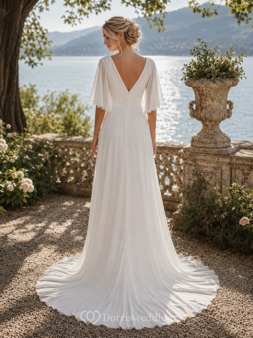 Vestido de novia de gasa con escote en V y mangas tres cuartos, estilo imperio. view 2