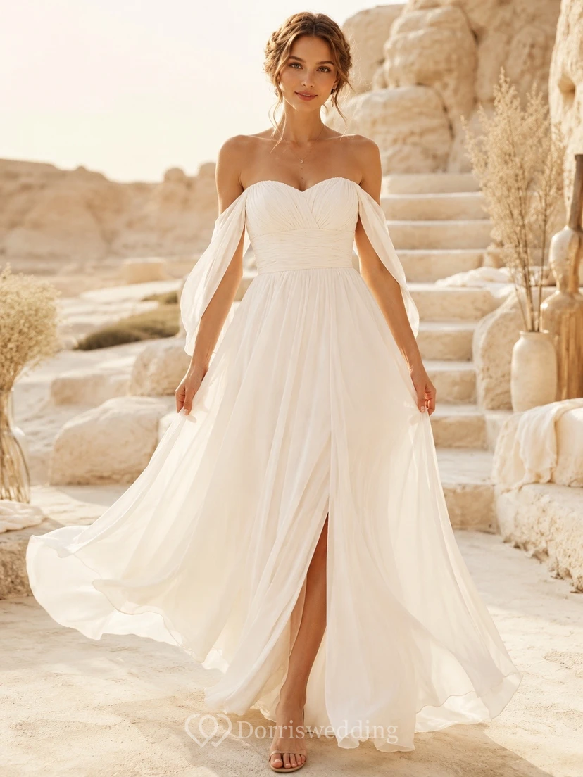 Vestido de novia de gasa con hombros descubiertos y mangas cortas, estilo vaporoso, ideal para una boda íntima.