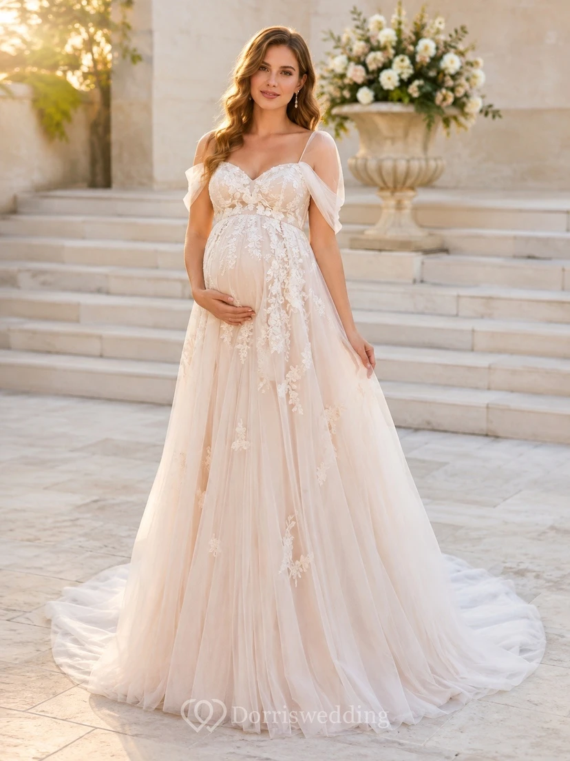 Vestido de novia premamá rosa rubor con hombros descubiertos y apliques florales