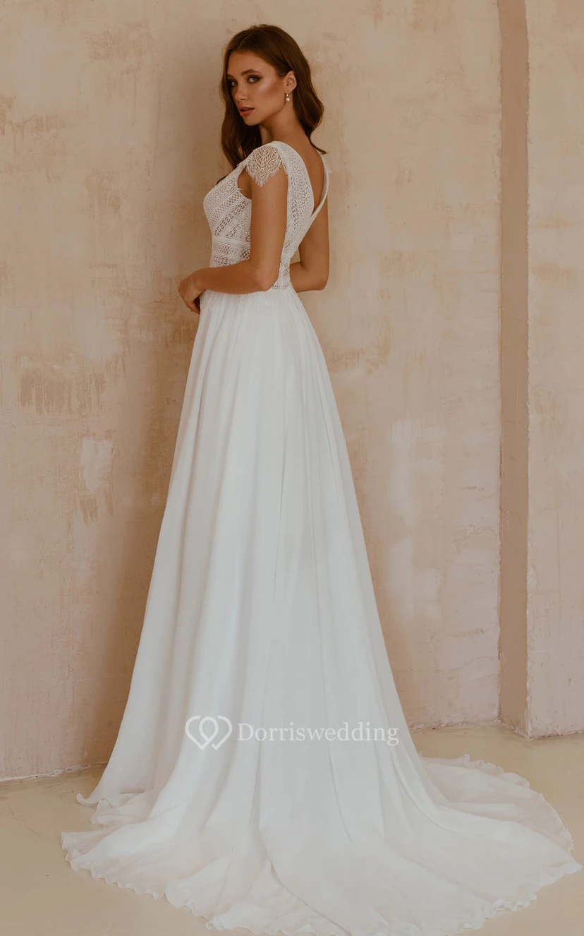 Robe de mariée bohème en mousseline de soie et dentelle, col en V, coupe trapèze, manches courtes, longueur au sol et traîne. view 2