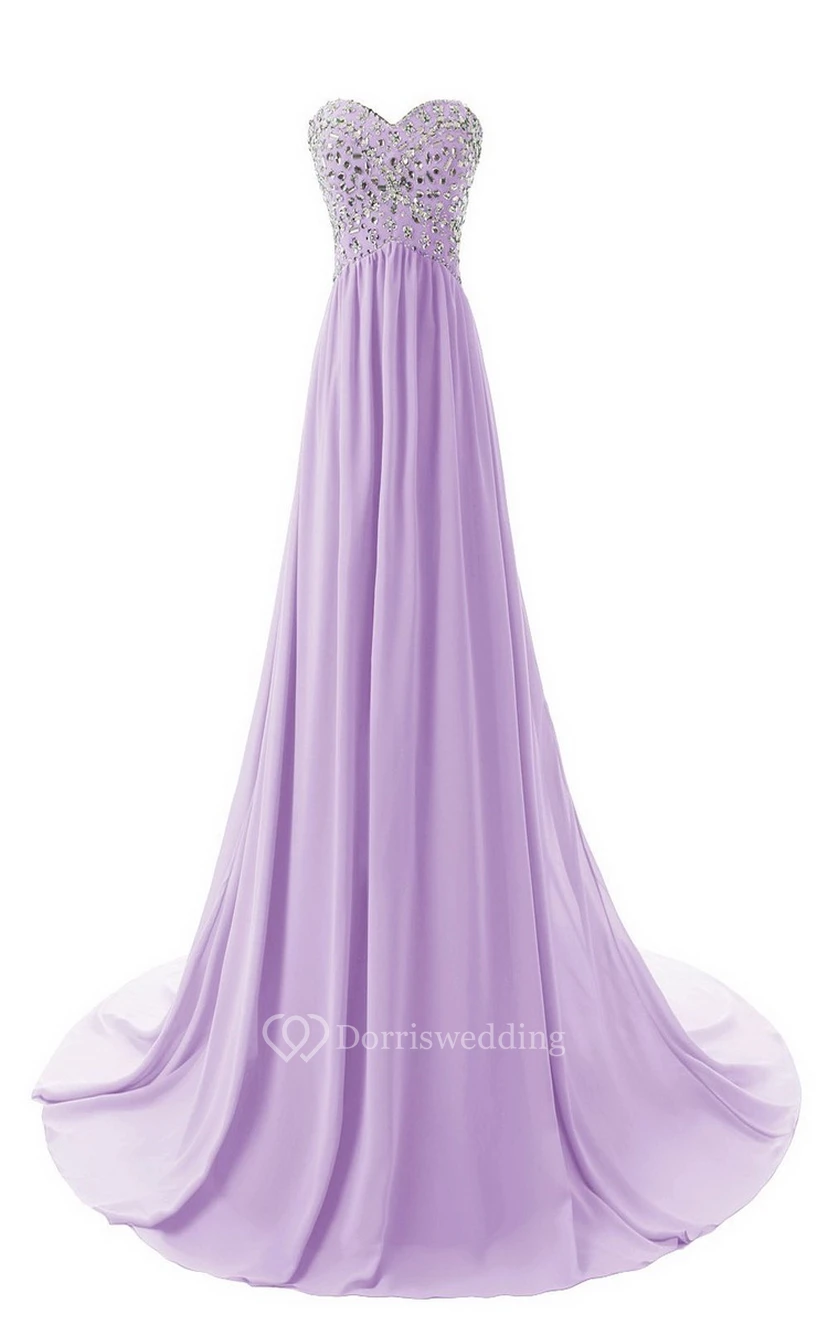 Vestido largo de gasa con escote corazón y corpiño de cristal.