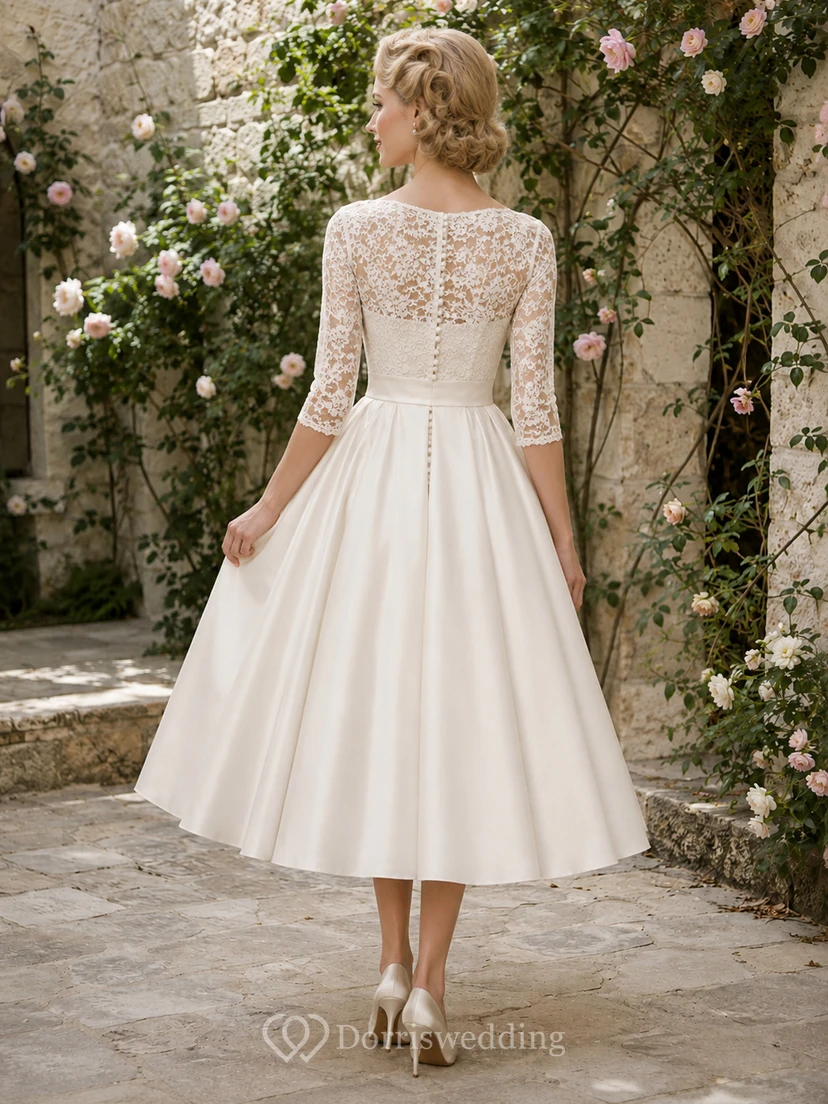 Vestido de novia vintage de satén y encaje, corte en A, cuello alto, manga tres cuartos, largo hasta la rodilla. view 2
