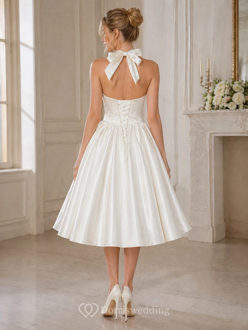 Vestido de novia de satén de largo midi con escote halter, lazo y espalda con cordones. view 2
