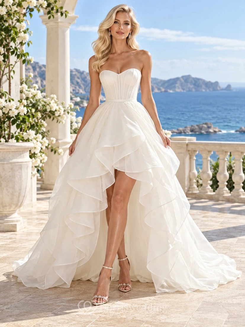Vestido de novia asimétrico sin tirantes, escote corazón, corsé, volantes y cola en línea A