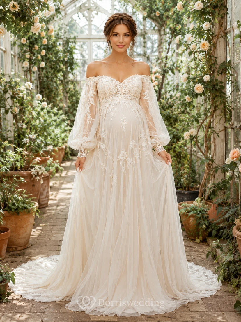Vestido de novia premamá con escote Bardot, manga larga, encaje, corte en A y romántica cola de tul.