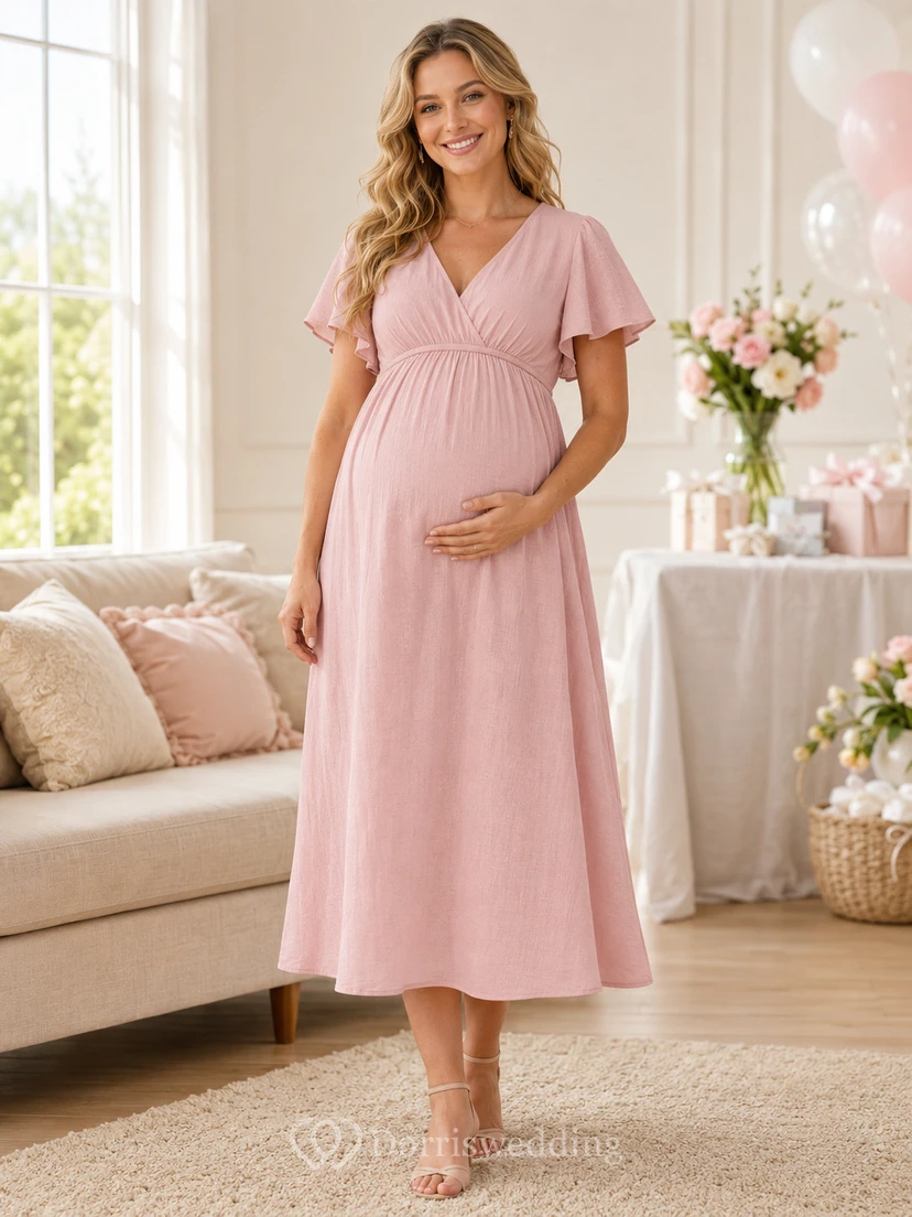 Vestido de maternidad informal de punto rosa rubor con cuello en V y mangas con volantes, largo hasta la rodilla.