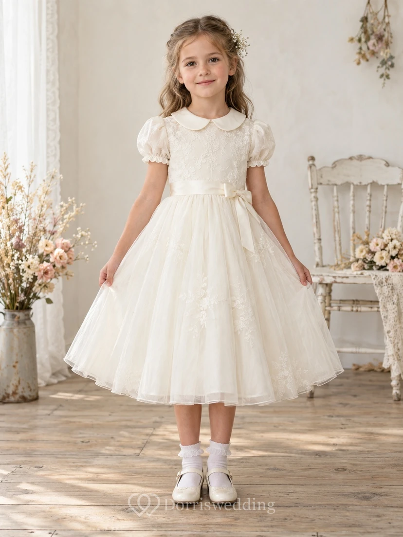 Vestido de niña de flores vintage color marfil, corte en A, tul, mangas abullonadas, corpiño de encaje y cuello Peter Pan, largo hasta la rodilla.