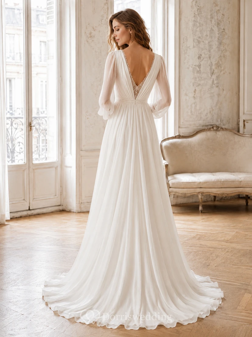 Robe de mariée de soirée raffinée en mousseline de soie, décolleté plongeant en V, manches gigot, coupe trapèze, traîne drapée, dos nu plongeant en V. view 2