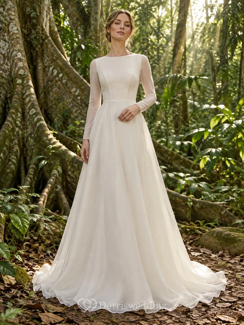 Vestido de novia sencillo y modesto de corte A con cuello joya, mangas largas transparentes y corpiño liso de gasa.