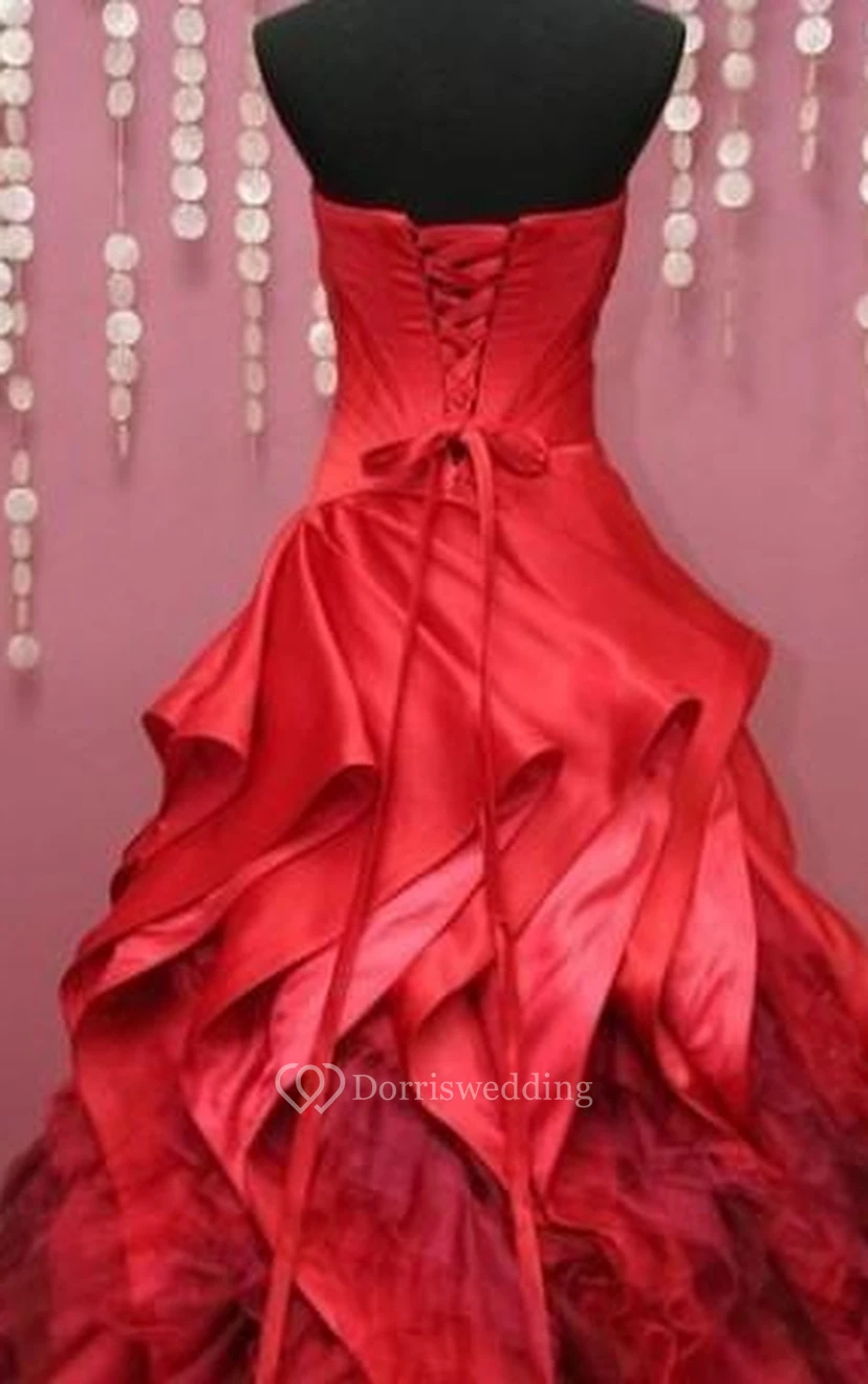 Vestido largo de gala con escote corazón, sin mangas, pliegues acampanados, cola de corte recto y espalda con cordones, de tul y encaje. view 3