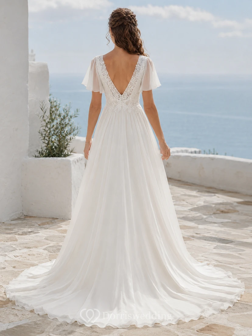 Robe de mariée trapèze en mousseline de soie à manches papillon et décolleté plongeant en V profond view 2