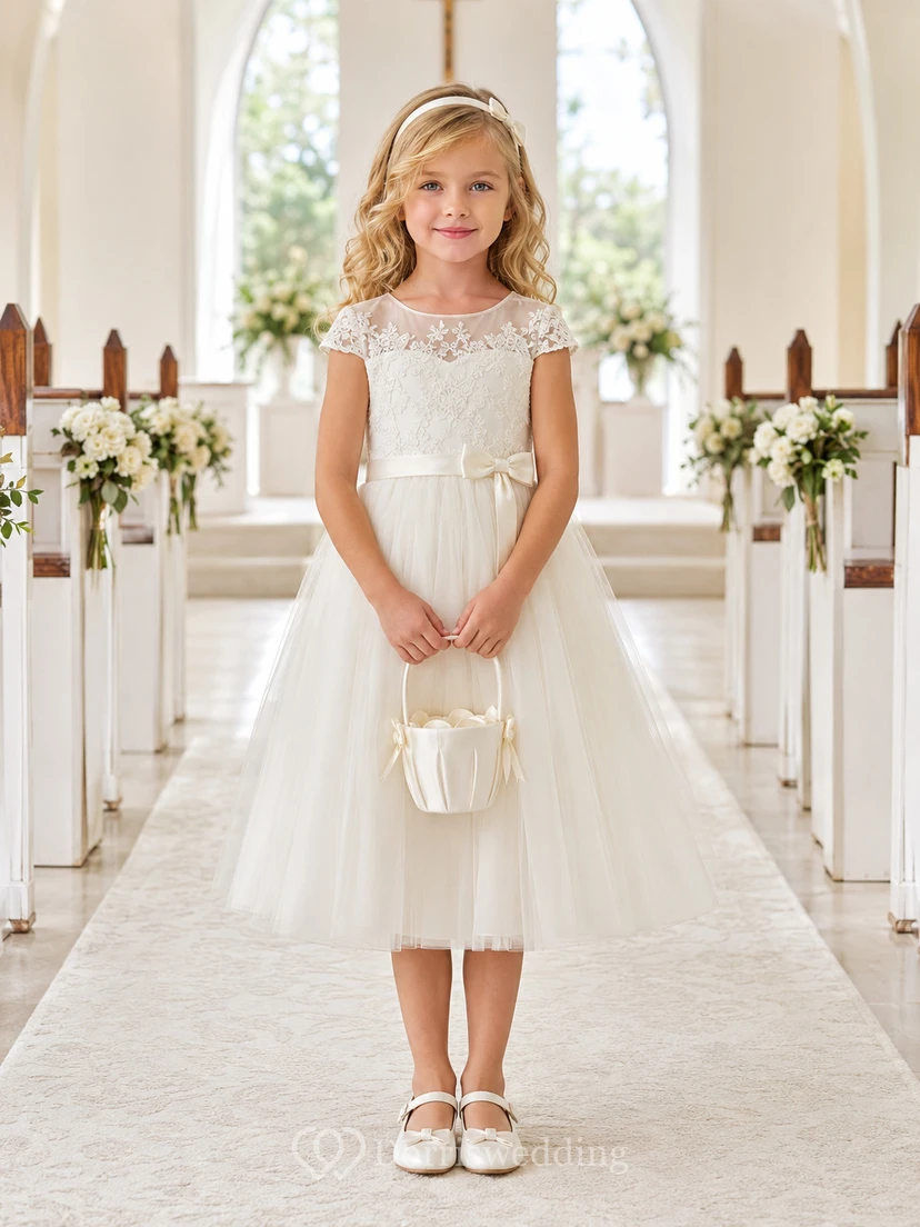 Vestido de niña de flores color marfil, largo hasta la rodilla, encaje, tul, corte en A, escote ilusión, manga corta, doble lazo, cremallera trasera.