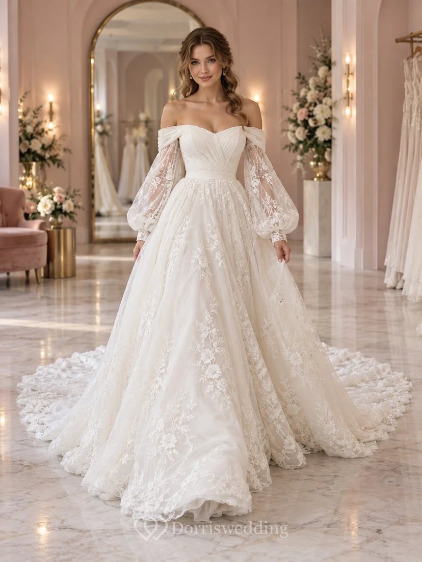 Vestido de novia romántico de manga larga, hombros descubiertos, encaje floral, tul y cola de capilla fruncida.