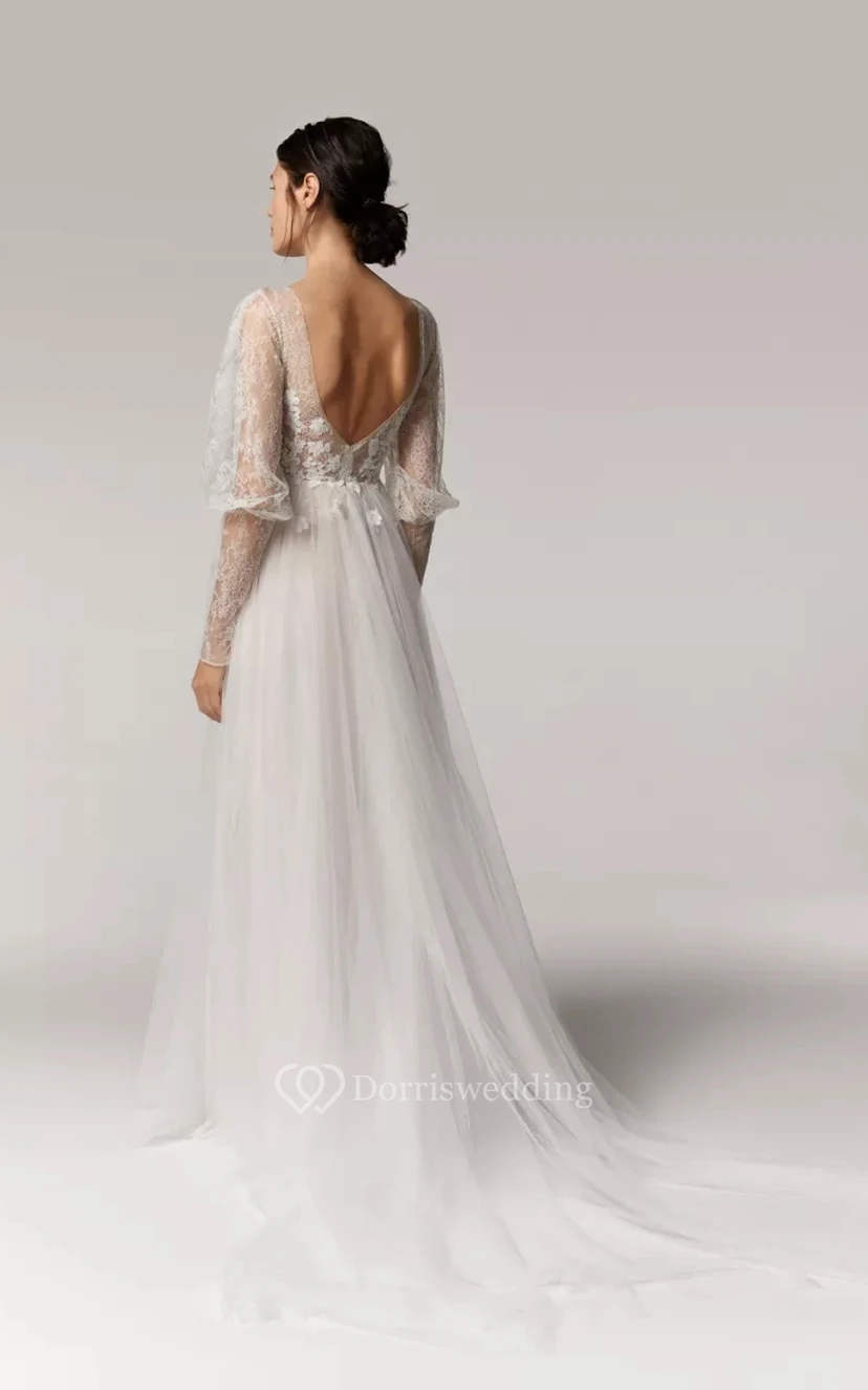 Vestido de novia bohemio de corte A con escote pronunciado, mangas largas abullonadas y falda de tul. view 2