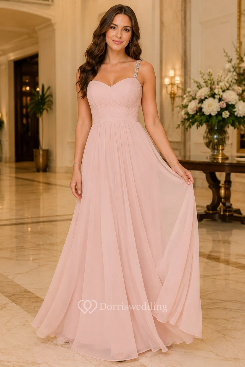 Robe de soirée en tulle rose poudré à décolleté cœur et coupe trapèze