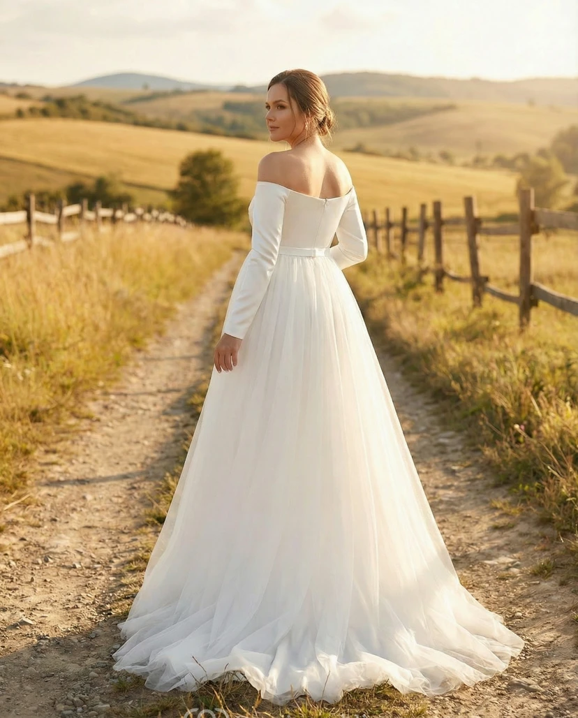 Robe de mariée de maternité à épaules dénudées et manches longues, avec surjupe en tulle et traîne. view 2
