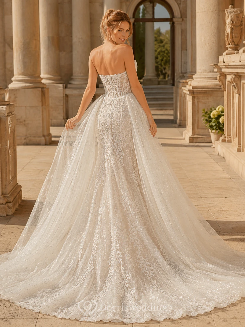 Robe de mariée de soirée en dentelle et tulle, bustier cœur, coupe trapèze, traîne chapelle, jupon amovible view 2