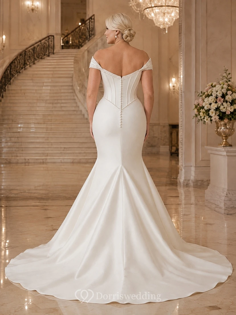 Vestido de novia clásico de satén con mangas cortas, hombros descubiertos, corte sirena y cola larga. view 2