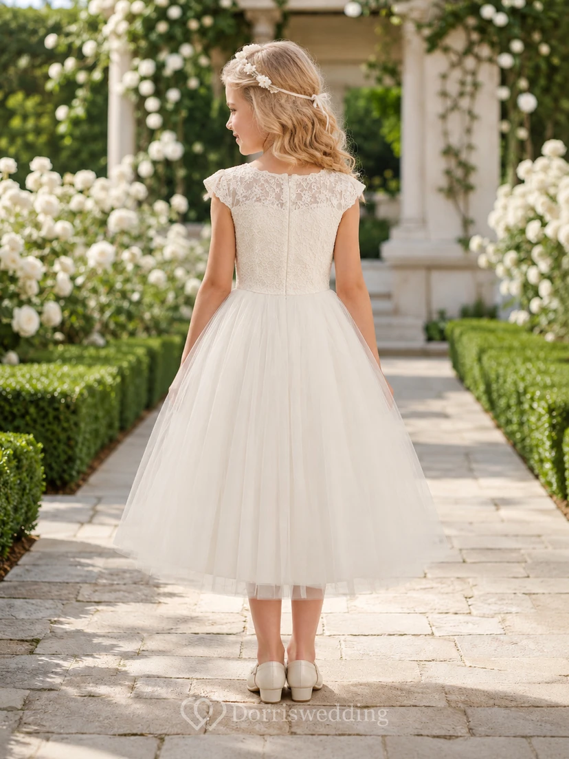 Vestido de niña de flores de tul y encaje con cintura vasca color marfil, corte en A, manga corta, cuello joya, largo hasta la rodilla, ideal para ceremonias en el jardín. view 2