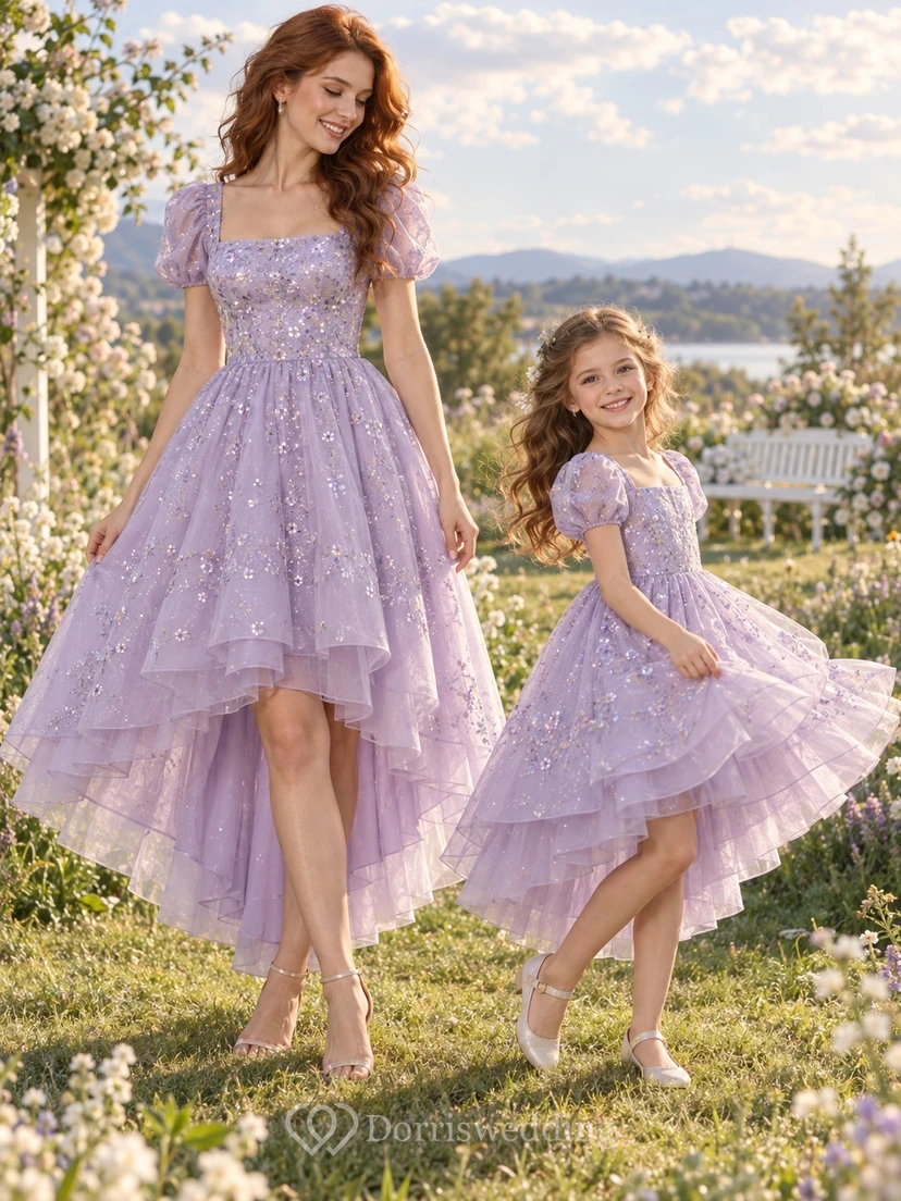 Vestido de fiesta a juego para madre e hija, color lavanda, con mangas abullonadas y corte asimétrico.