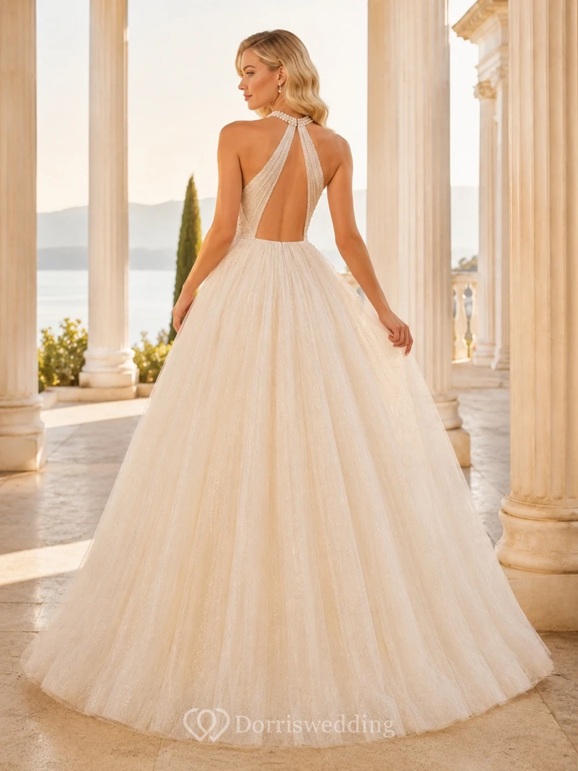 Vestido de novia largo hasta el suelo con escote halter y falda de tul plisada. view 2