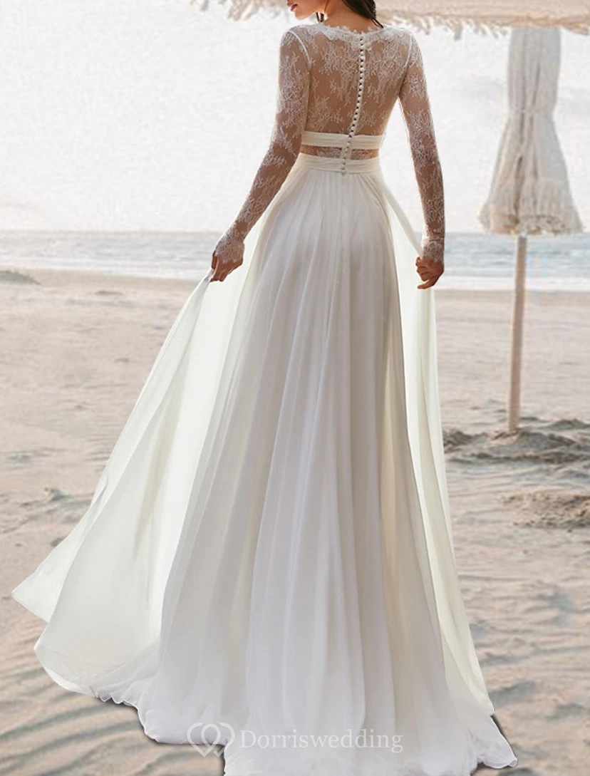 Vestido de novia etéreo de gasa con corte en A y mangas transparentes. view 2