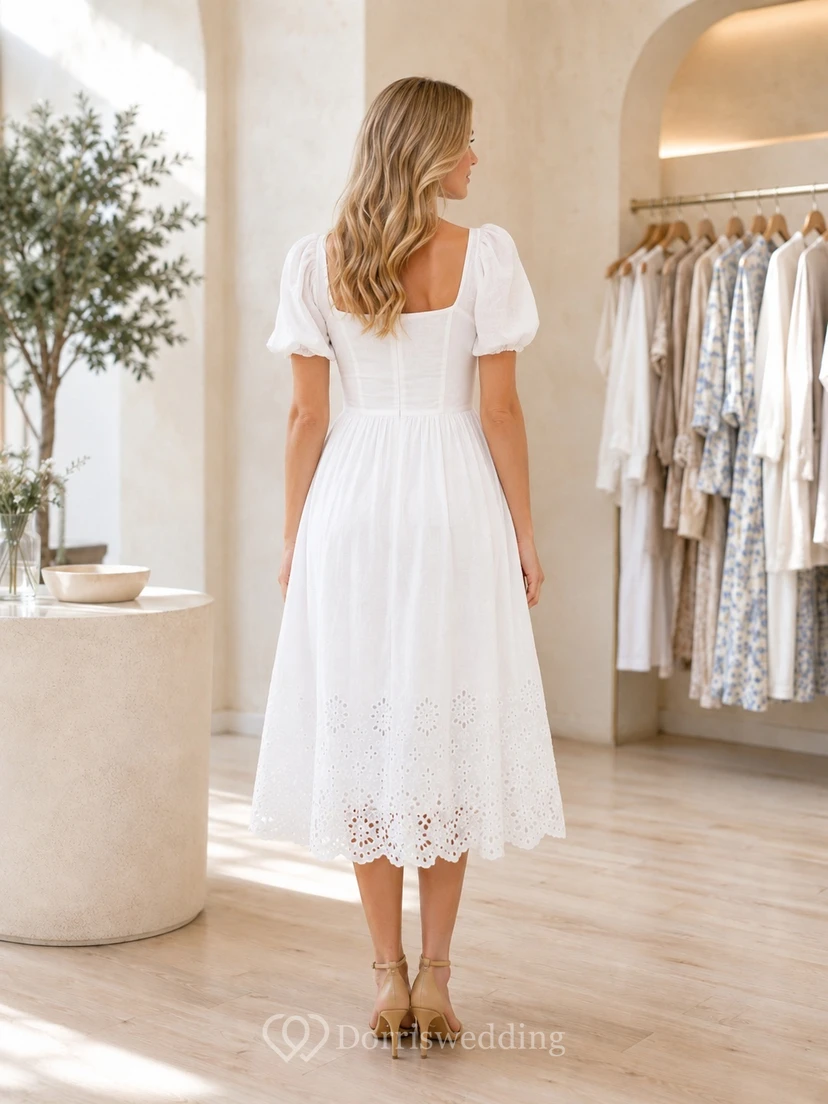 Robe d'invitée de jardin blanche à œillets, col carré, manches bouffantes, coupe trapèze, longueur thé view 2