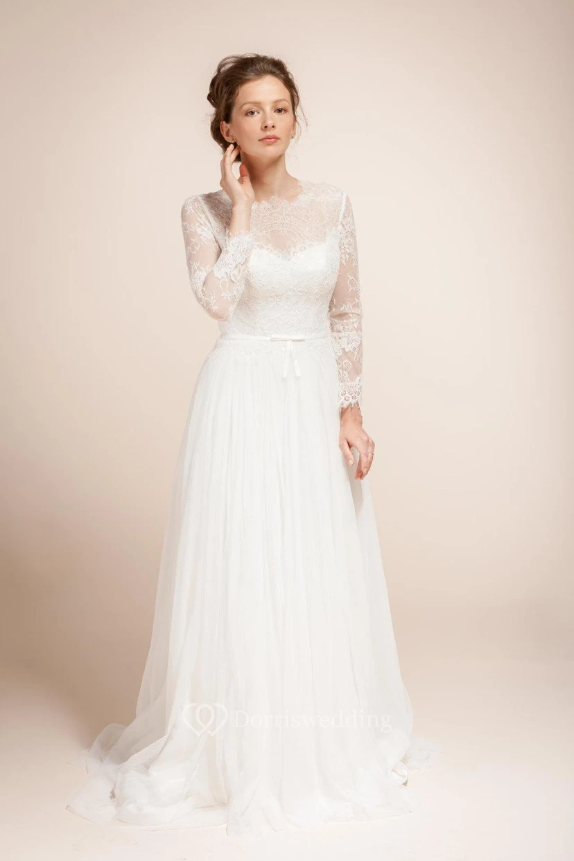 Vestido de tul de corte A con mangas largas efecto ilusión, corpiño de encaje y espalda ilusión.