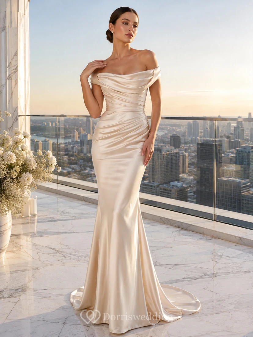 Lujoso vestido de novia de satén drapeado con hombros descubiertos para una fuga romántica en un ático.