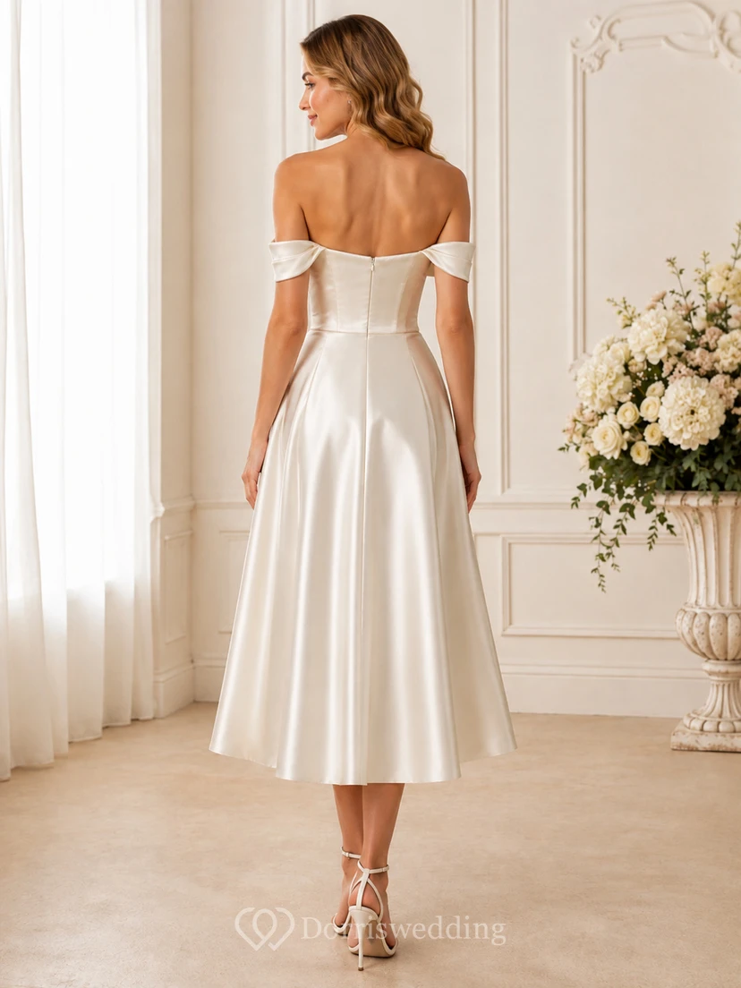 Robe de mariée en satin, coupe trapèze, longueur thé, épaules dénudées, manches courtes, décolleté en cœur et taille naturelle, manches courtes, col rabattu. view 2