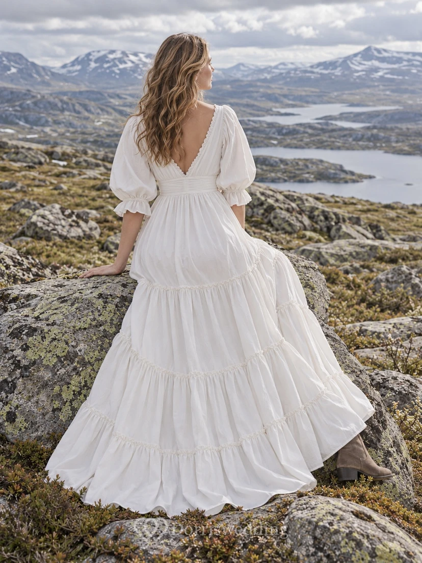 Vestido de novia bohemio de popelina de algodón con escote en V, corte en A, mangas abullonadas y falda escalonada. view 2