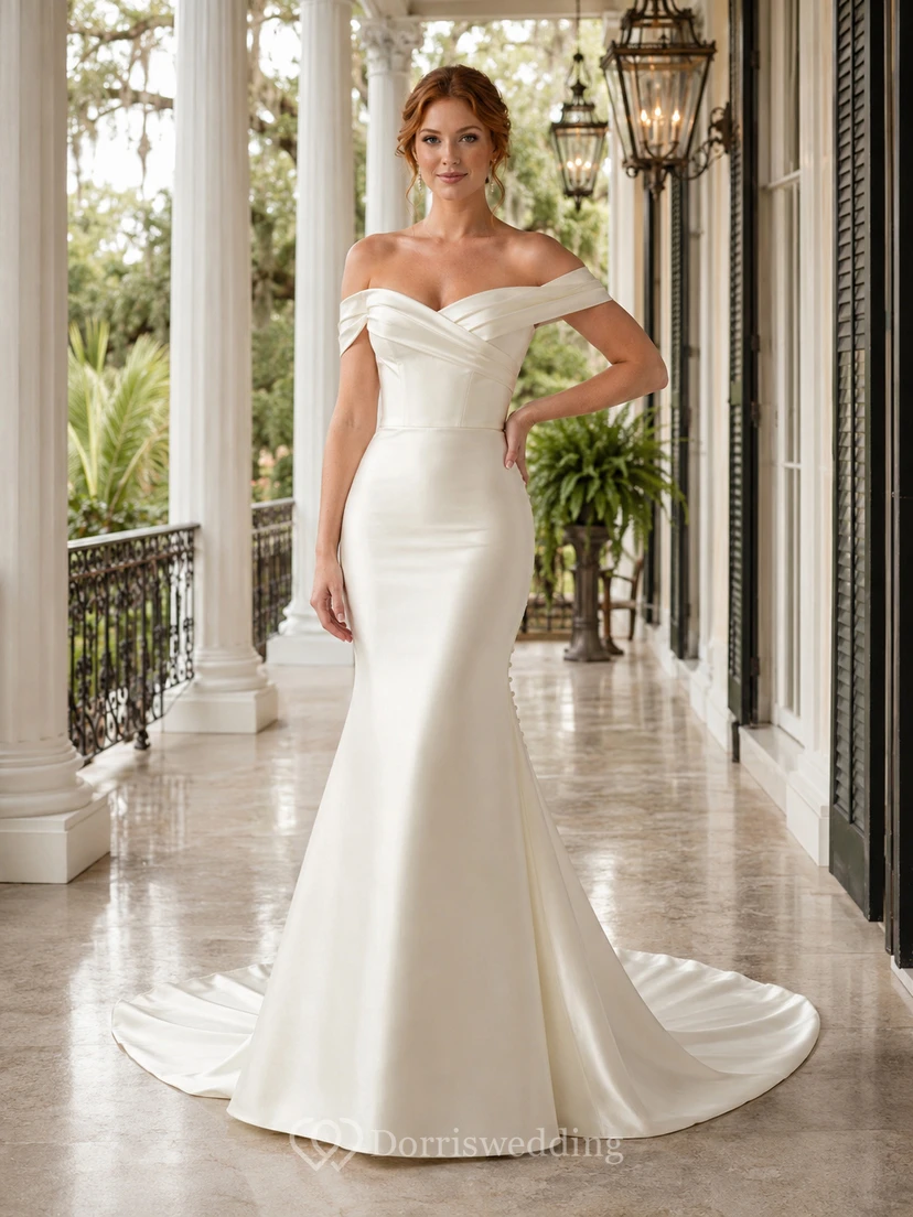 Robe de mariée sirène élégante en satin drapé à épaules dénudées, idéale pour une cérémonie formelle dans un manoir de destination.