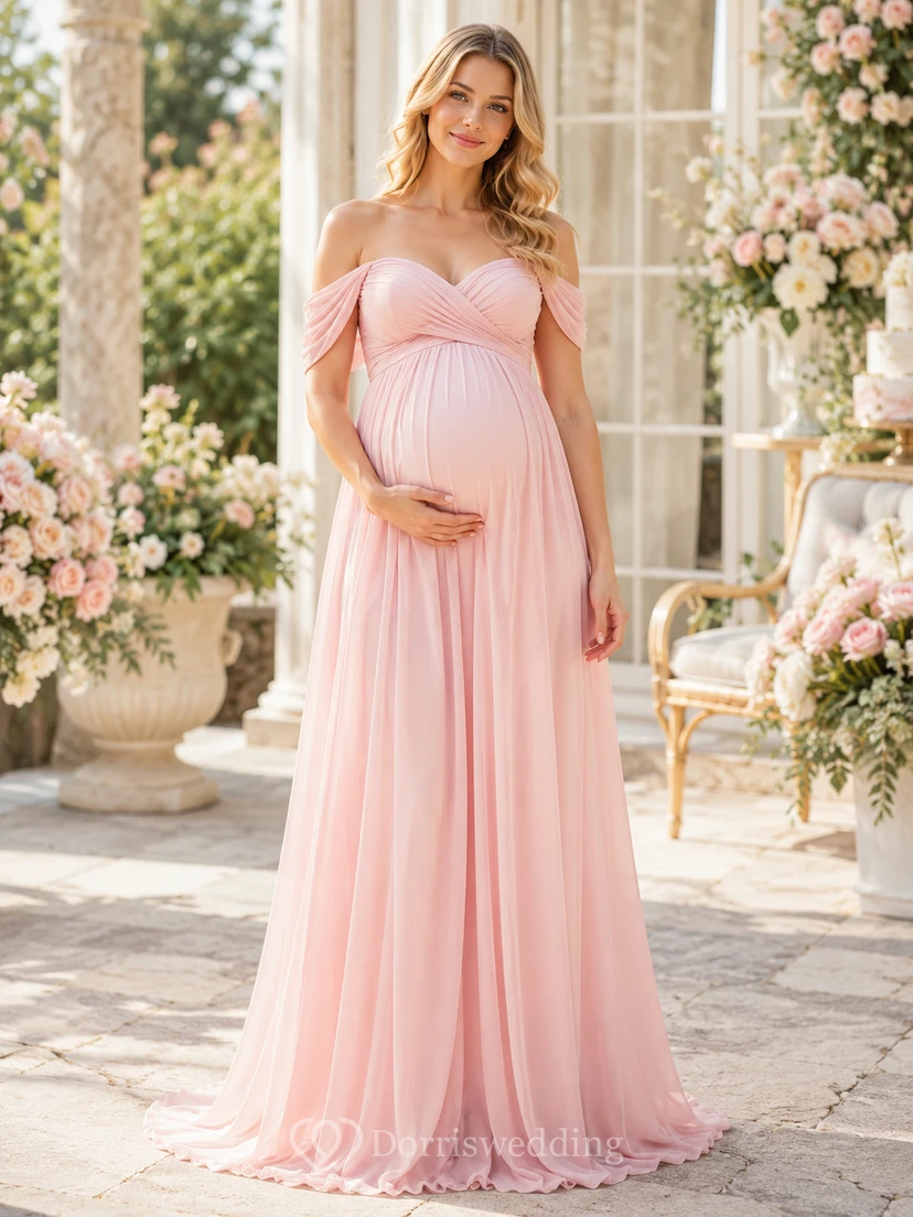 Robe de maternité rose poudré à épaules dénudées, bustier empire en mousseline, longue jusqu'au sol, idéale pour une baby shower.