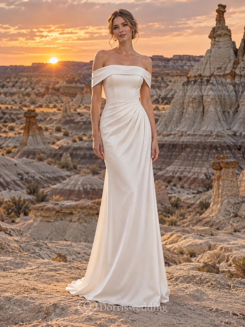 Vestido de novia sencillo de satén liso, largo hasta el suelo, con hombros descubiertos y mangas cortas.