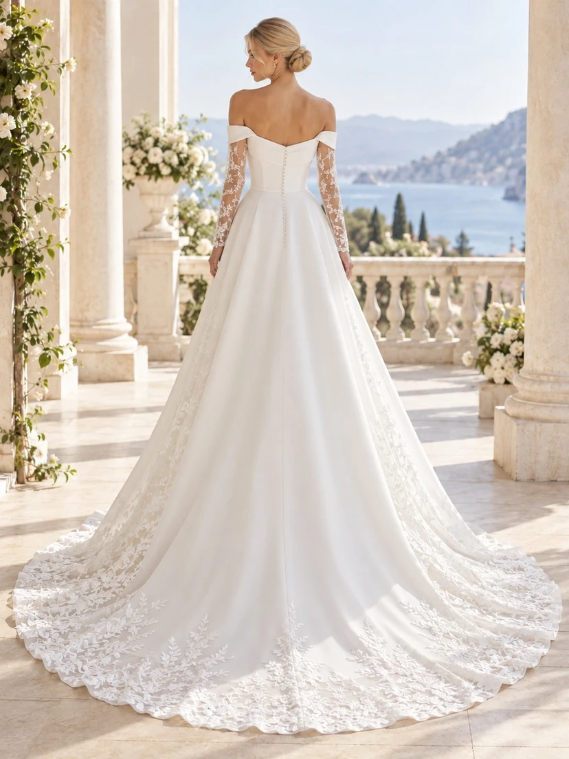 Vestido de novia romántico de corte A, largo hasta el suelo, con corpiño estructurado, mangas largas, hombros descubiertos, encaje floral y satén. view 2