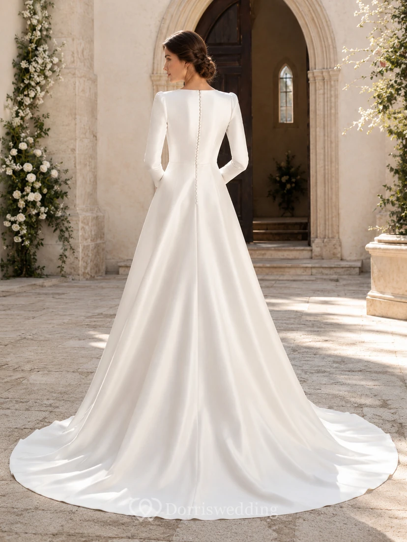 Vestido de novia minimalista de satén, corte A, escote barco, manga larga, cola de corte princesa. view 2