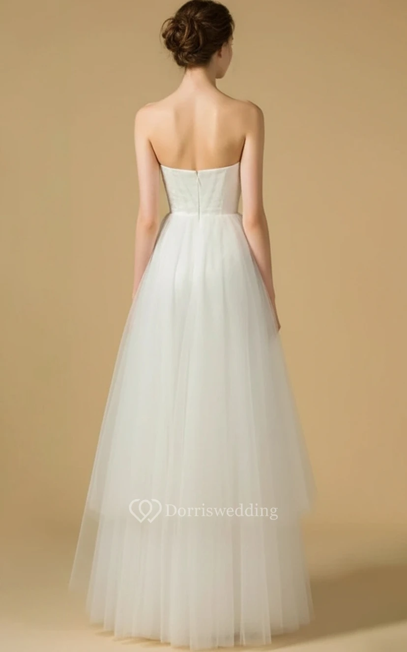 Mono de novia sin tirantes con escote corazón y falda de tul plisado de múltiples capas. view 2